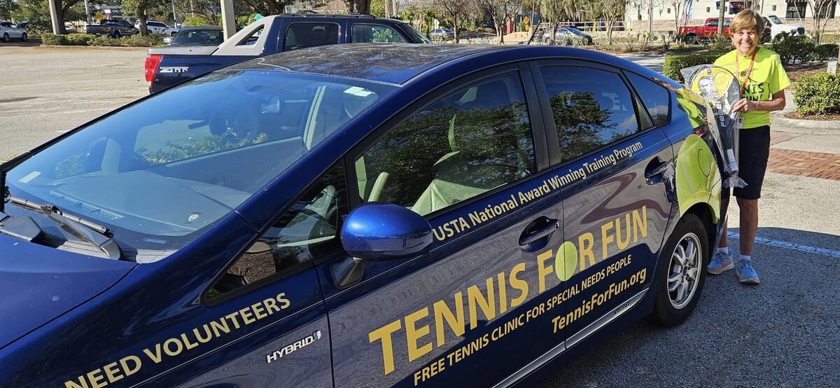 A group of tennis players gathered at the courts.