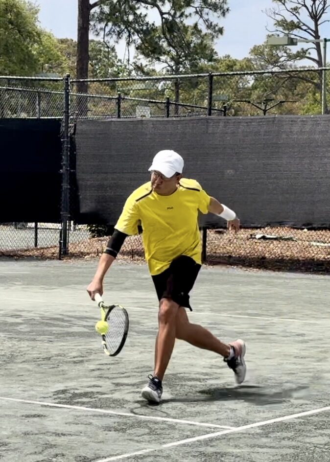 A local player posing at the tennis courts.