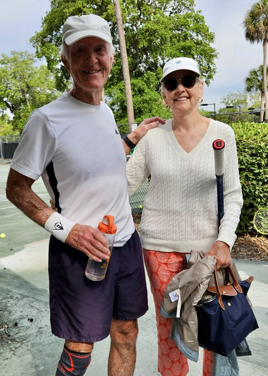 Two customers together at the tennis courts.